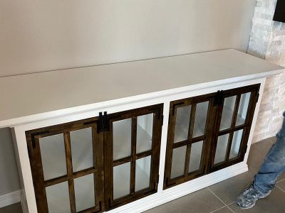 media console with glass doors