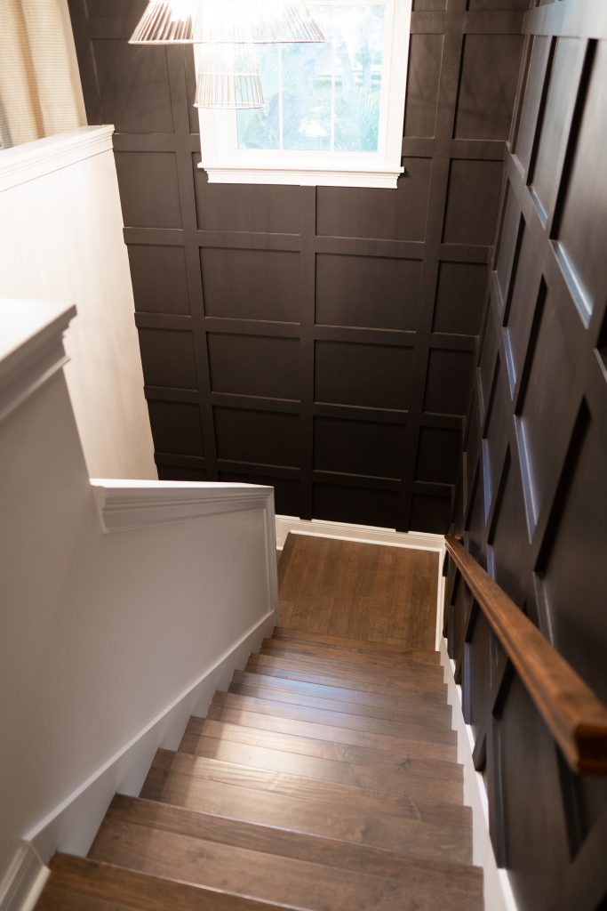 Black board and batten wall staircase
