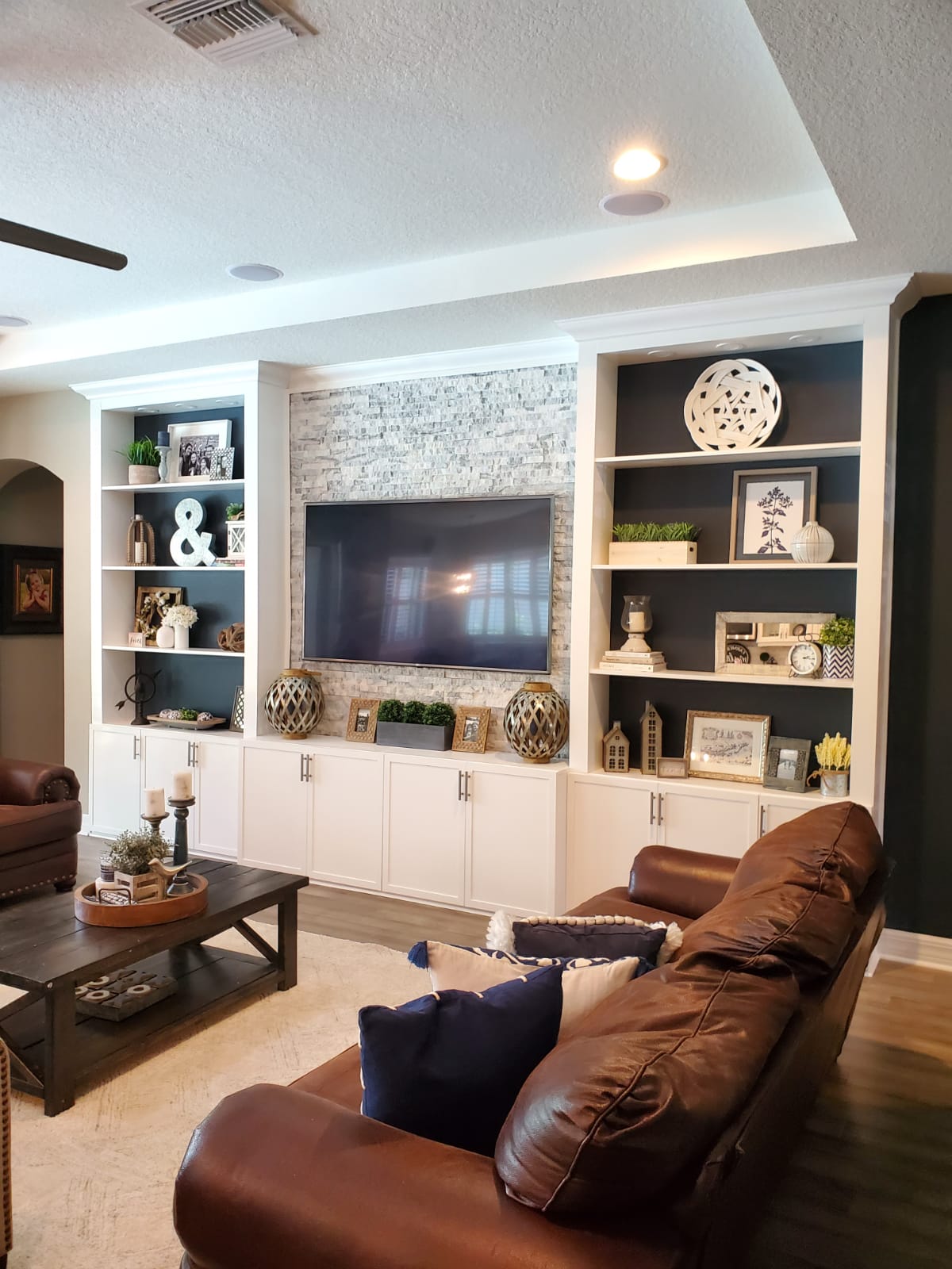 Custom White and Blue Built-in Entertainment Center and Stone Accent Wall